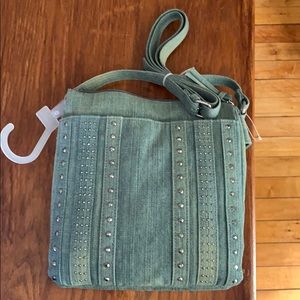 Denim bad with metal embellishments
